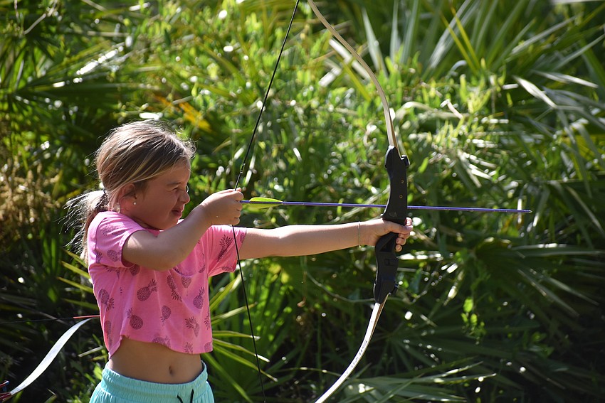Bradenton's 7-year-old Ensley Rondenne learns archery at Rye Preserve May 3.