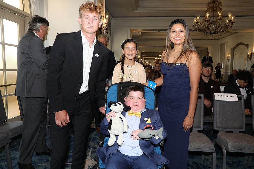 Lucas Ticola (center), Britt Redman, Chloe Grimes and Katie Ballesteros are part of Dick's All-Courageous Team at the 20th Annual Dick Vitale Gala held at the Ritz-Carlton on May 2.