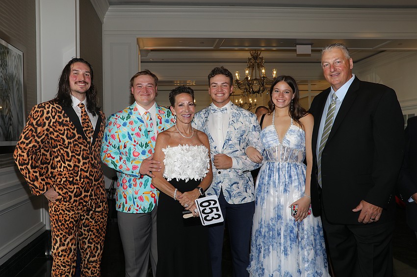 Mom Tammie Johnson (center) takes credit for styling her family's wardrobe including sons Charlie, Zack, Eddie, friend Makenna Harvey, and Tammie's husband, Charlie.