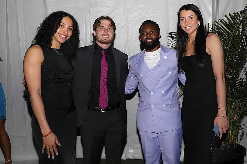 UConn's women's basketball guards Azzi Fudd and Caroline Ducharne are introduced to Steven Hieneman and N'Jhari Jackson at the VIP event held before dinner.