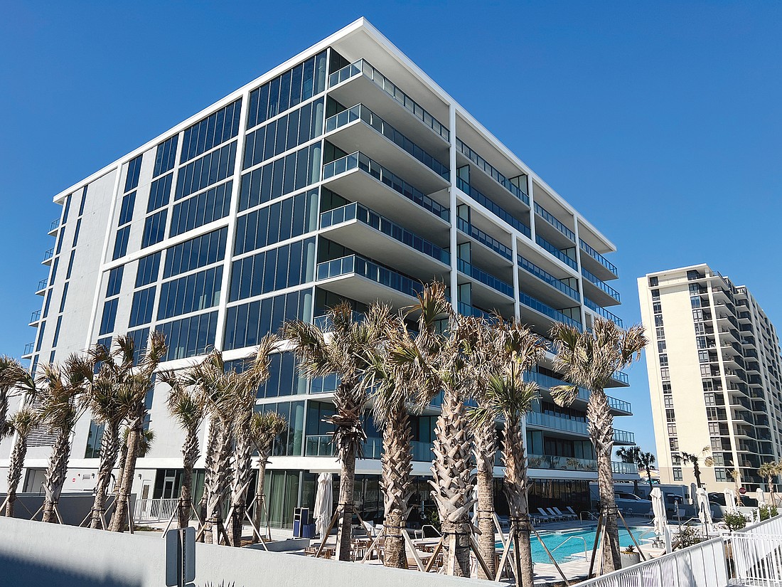 Oceanfront condominium unit with community amenities featuring fitness center, outdoor bar, game room, pool and parking garage.