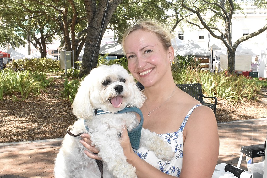 Kamila Kozak came with her dog Dyzio to support her friend and neighbor Julia Bernadsky, who founded Untamed Hearts, a jewelry business that supports Ukraine.