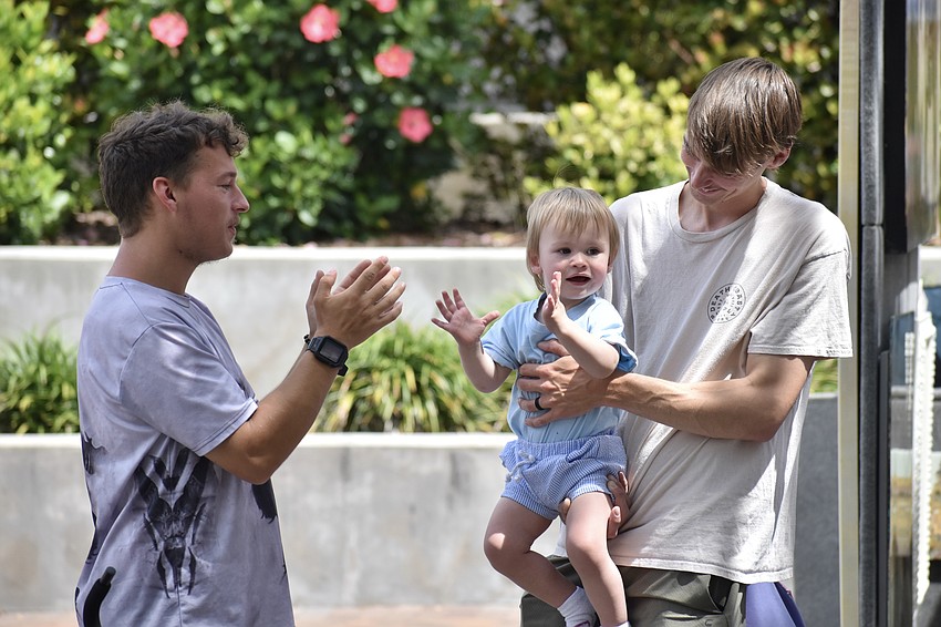 Felix Aulozzi, his nephew Rowan Aulozzi, 1, and brother Andrew Aulozzi enjoy the festival together.
