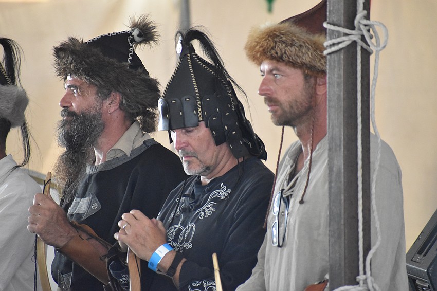 Farky Füszfás, Robert Szalay and Gabor Török stand as the Hungarian and American national anthems are performed.