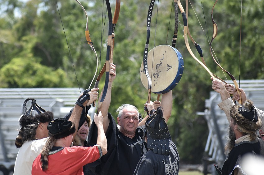 The archry show concludes, with Attila Toth at the center of the group.