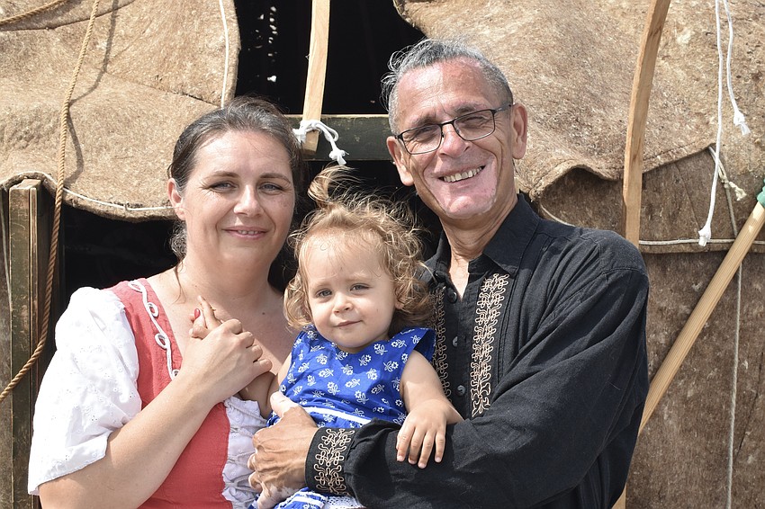 Marta Sumegi, her daughter Reka Lakatos, 1, and her husband Istvan Lakatos of Clearwater stand in front of their yurt, a portable tent used by those with a nomadic lifestyle.