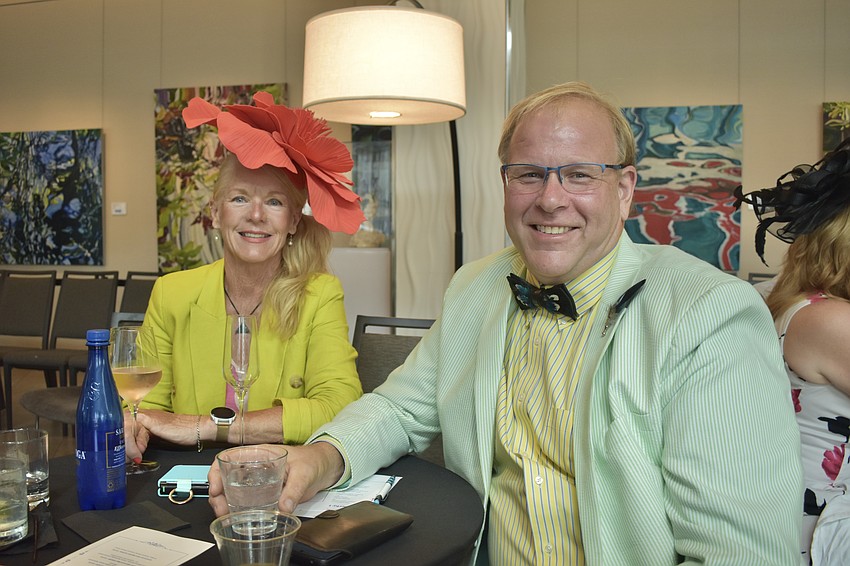 Karen Hall and her partner Paul Voloshen watch the musical performance.