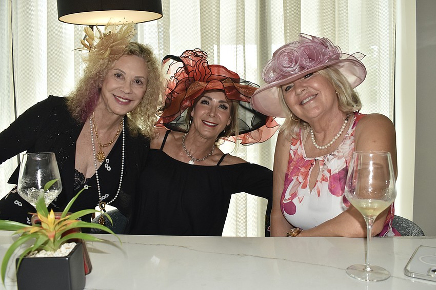 Rayray Banks, Susanne Reisinger and Pia Simonson gather together at a table.