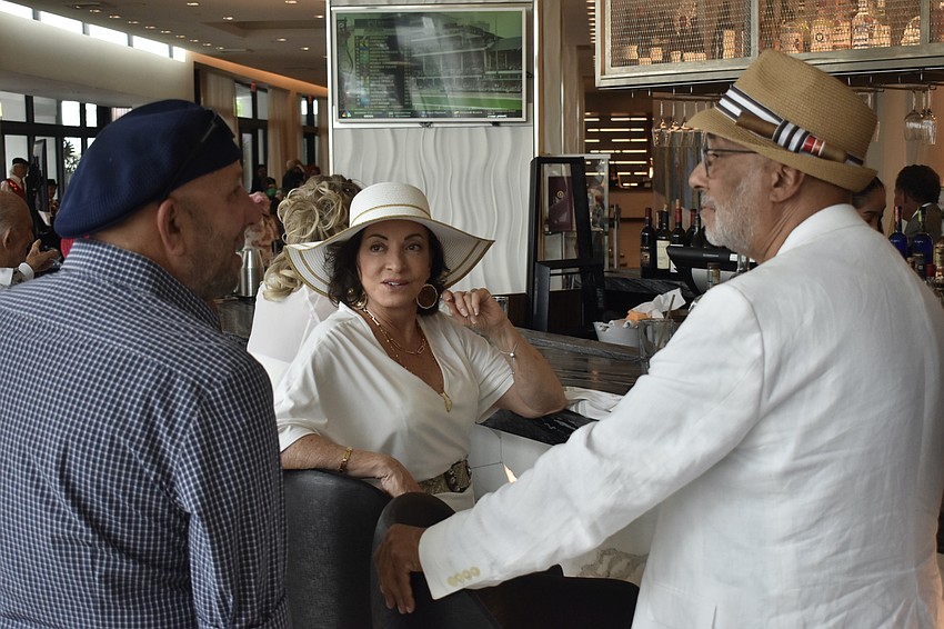 David Jabara talks with Maria Valente and her partner Patrick Jackson.