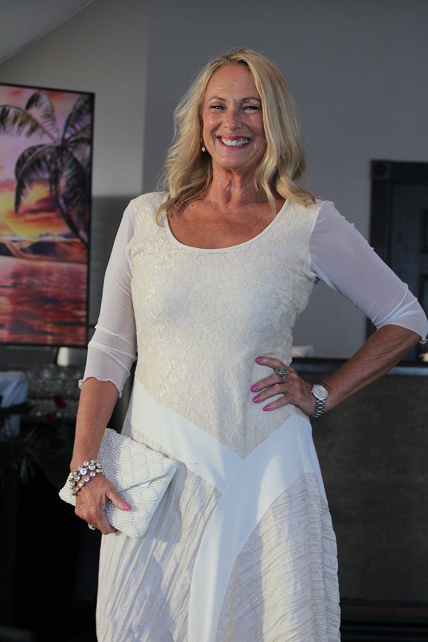 Diane Polen models an all-white look at the Teen Court fundraiser fashion show by FemCity.