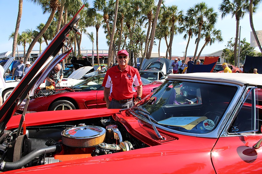 Don Buckman shows off the engine of his 1967 Red Convertible C2.