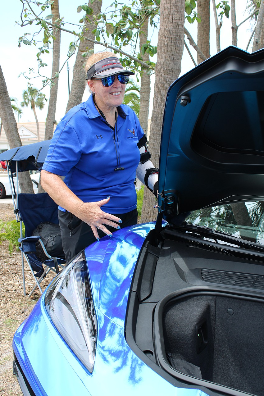 Randi Berthold matches her manicure to her custom 2021 Blue Chrome Convertible.