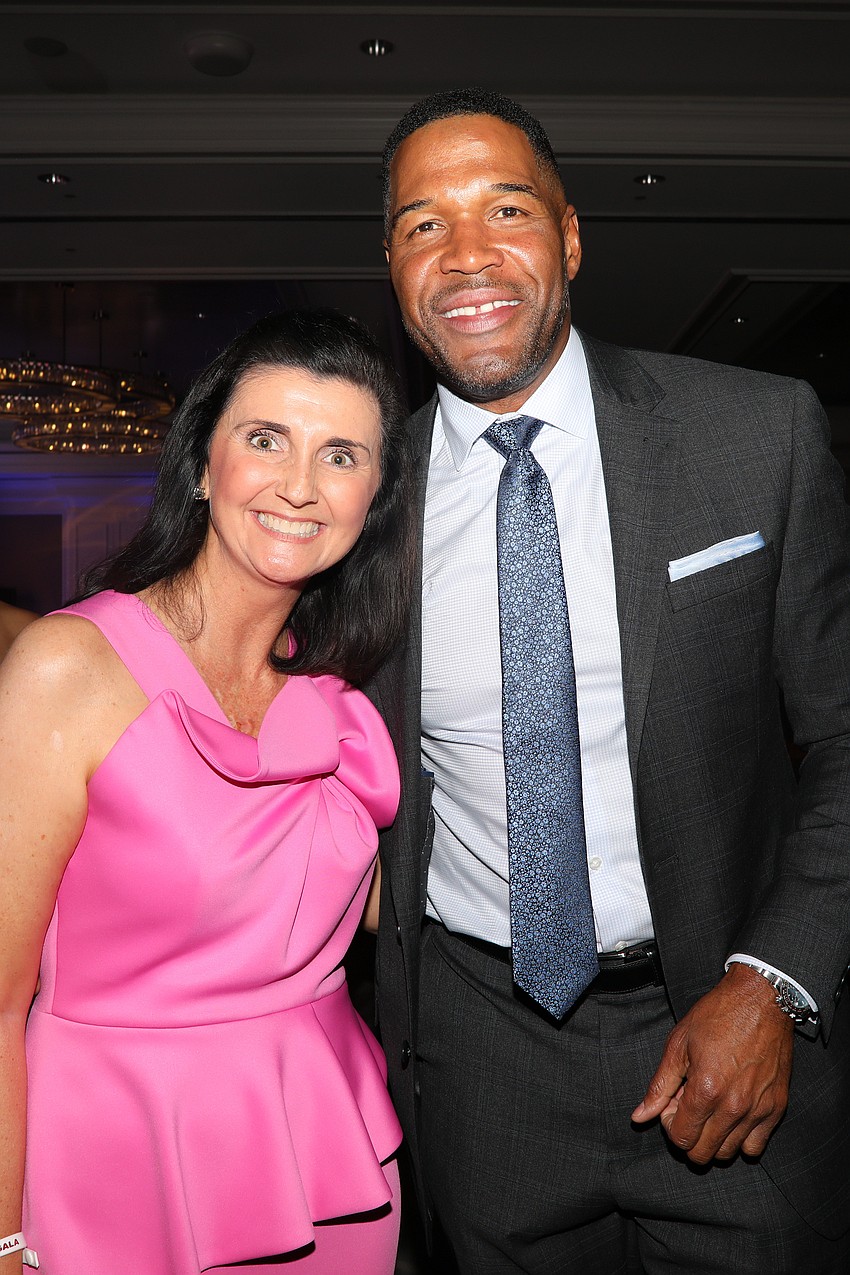 Jessica Rogers with pro-football hall of famer, Good Morning America host, and 2025 honoree Michael Strahan