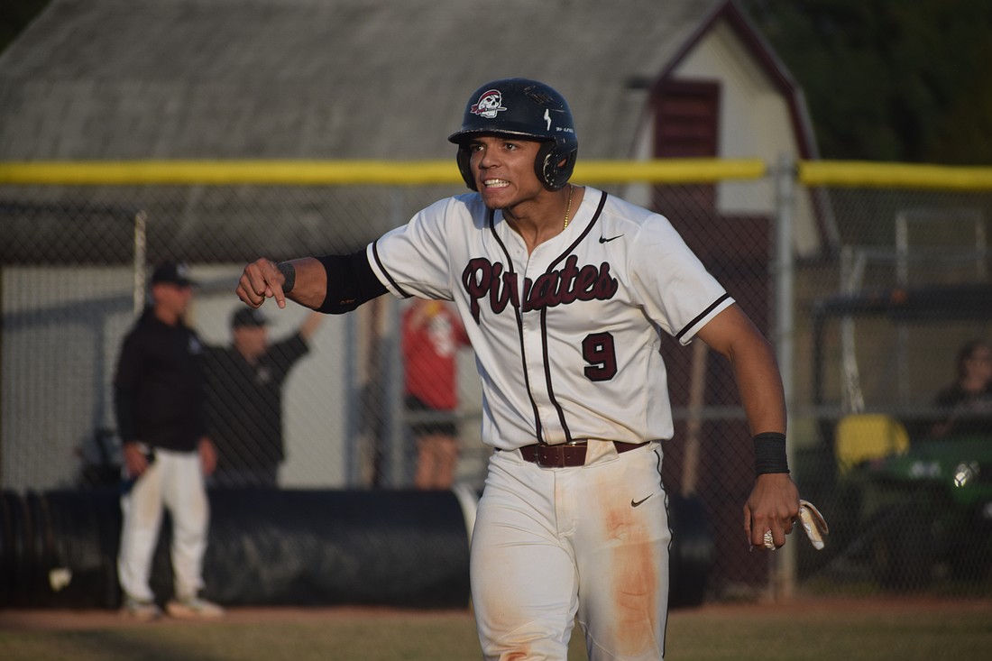 Pirates senior Nick Curbelo celebrates scoring the first run of a 9-3 win over Manatee on a triple by senior Camden Pope in a regional semifinal game on May 1 at Braden River High School.