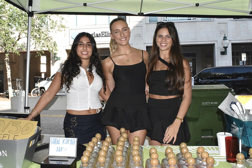 Clara Keyvani, Emily Schneider and Maddie Scholten of The Patrón Spirits Company offer tequila at the event.