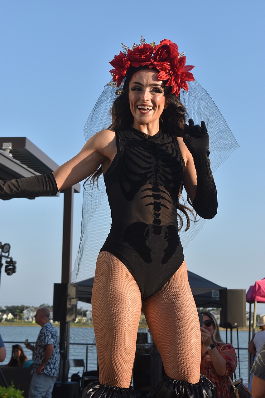 Natasha Eriksen became a stilt walker in 2022 and was trained by Nicole Grannie, the other stilt walker at the Cinco de Mayo event at Agave Bandido.