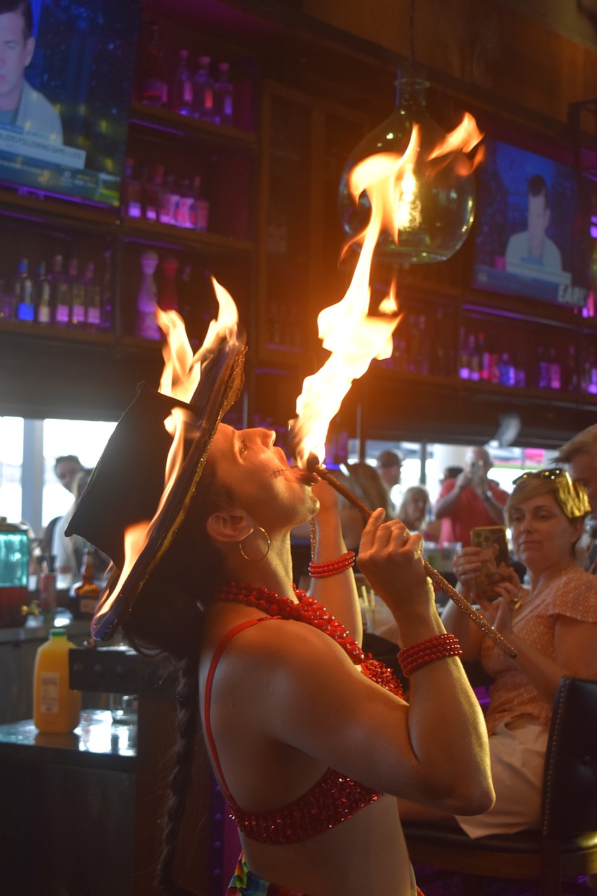 Fire performer Gaby Rosa of Prism Artistry puts some spark into the Cinco de Mayo celebration.