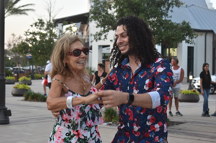 Lakewood Ranch resident Brenda Ianiro joins Zavio Javier of Dance Fever Sarasota to dance during the Cinco de Mayo celebration.