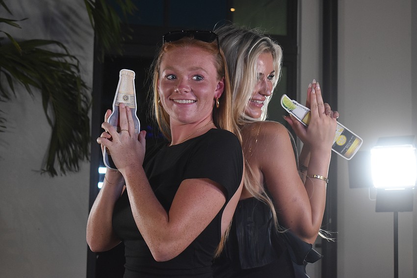 Sarasota residents Grace Watson and Ryleigh Nader strike poses for the 360 Reese Photobooth. Nader says it was exhilarating, making her feel like she's on a red carpet.