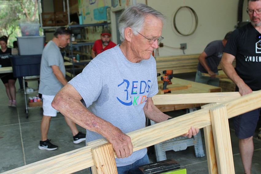 Bill Robb, the secretary of the board for Beds for Kids and a retired Navy pilot, says he always wanted to work with wood. 