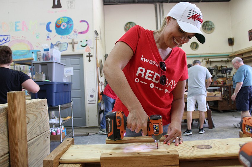 Tabatha Diedrich of Movement Mortgage knows the drill. Movement Mortgage was a sponsor of the Red Day event.