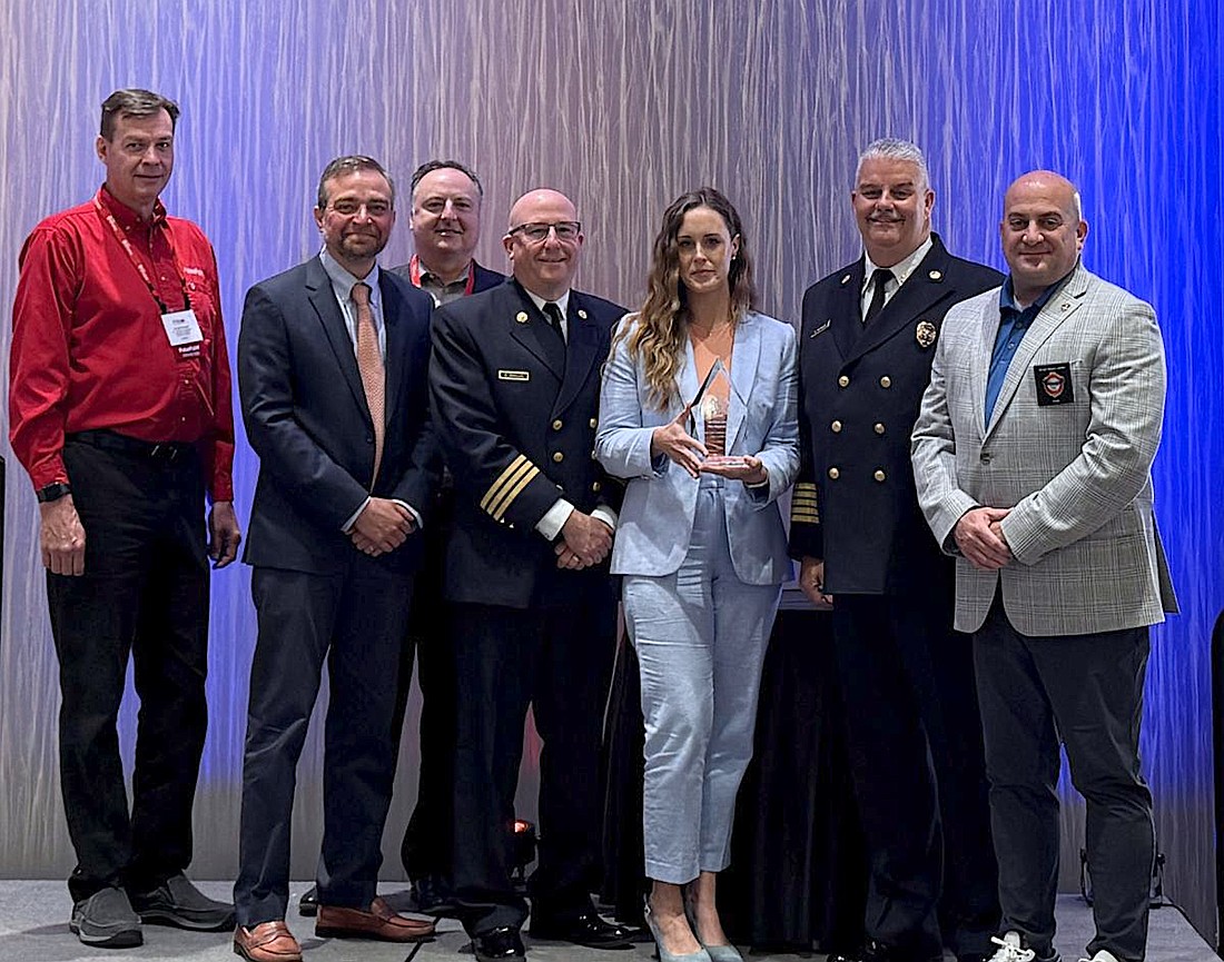 Members of the Sarasota County Fire Department accept the Heart Safe Award from the International Association of Fire Chiefs.