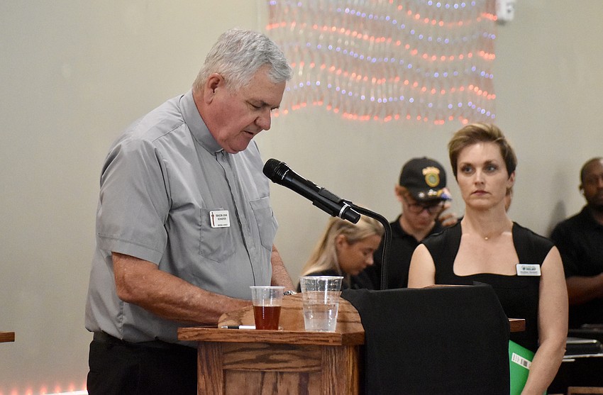 Deacon John Schaefer leads the opening prayer.