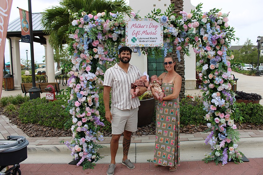 Waterside's Andrew and Kristine Santucci hold their 2-month-old twins Scarlett and Zayden during the Mother's Day event May 10 at Waterside Place. At 38, Kristine said she was blessed to be celebrating her first Mother's Day as a mom.