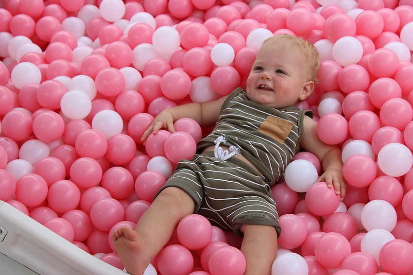 Sarasota 11-month-old Bryce Bauer is having the time of his young life in a vat of plastic balls during the Mother's Day event May 10 at Waterside Place.