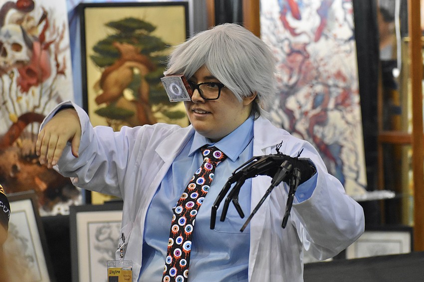 Cleo Warn, dressed as Dr. Harley Sawyer from Poppy Playtime, participates in the dance by ShimmyBOOM Bellydance.