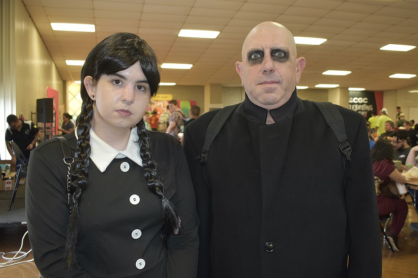 Alexis Sullivan and her father Chris Sullivan dressed as Wednesday Addams and Uncle Fester.