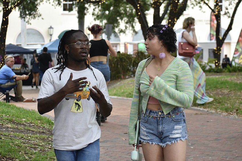 Robert Tribluan of Sarasota talks with Hillary Vartas of Orlando.