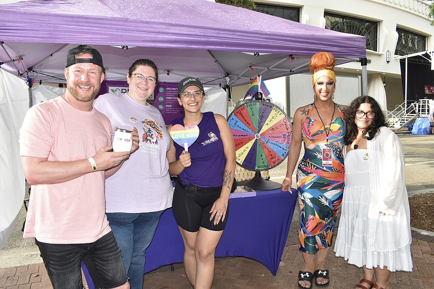 Joshua Beadle, Julie Wells, Marina Linner, emcee Brianna Summers and Helen Salomon gather at the tent of stage sponsor Orenda Health and Wellness.