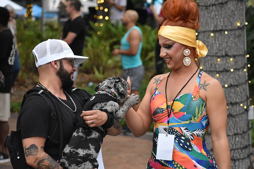 Mackenzie “MJ” Jianelli of Orenda Health and Wellness brings his new dog, Gunner, to greet emcee Brianna Summers.