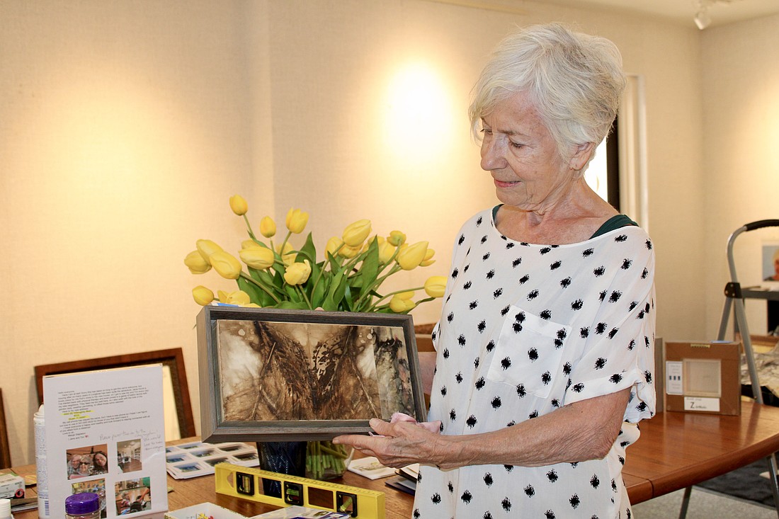 Printmaker Zerbe Sodervick contemplates which pieces to include in her first showcase at All Angels by the Sea Episcopal Church.