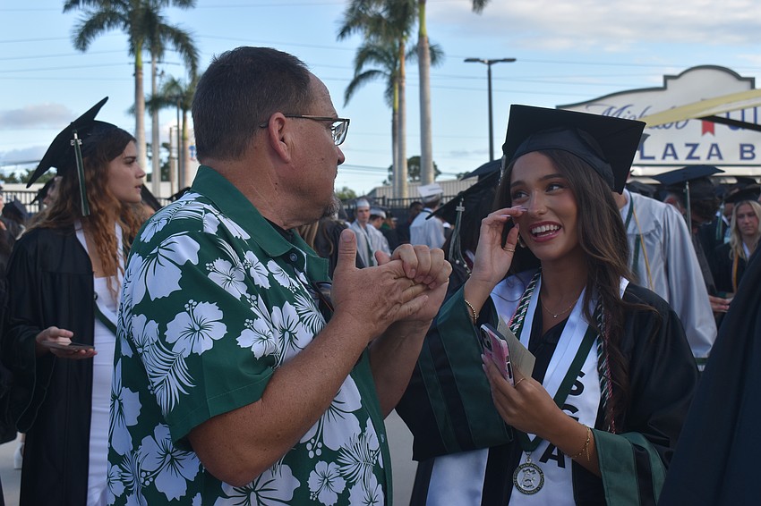 Michael Wood, a Lakewood Ranch High School English teacher, gives words of advice to Katelyn Riley. 
