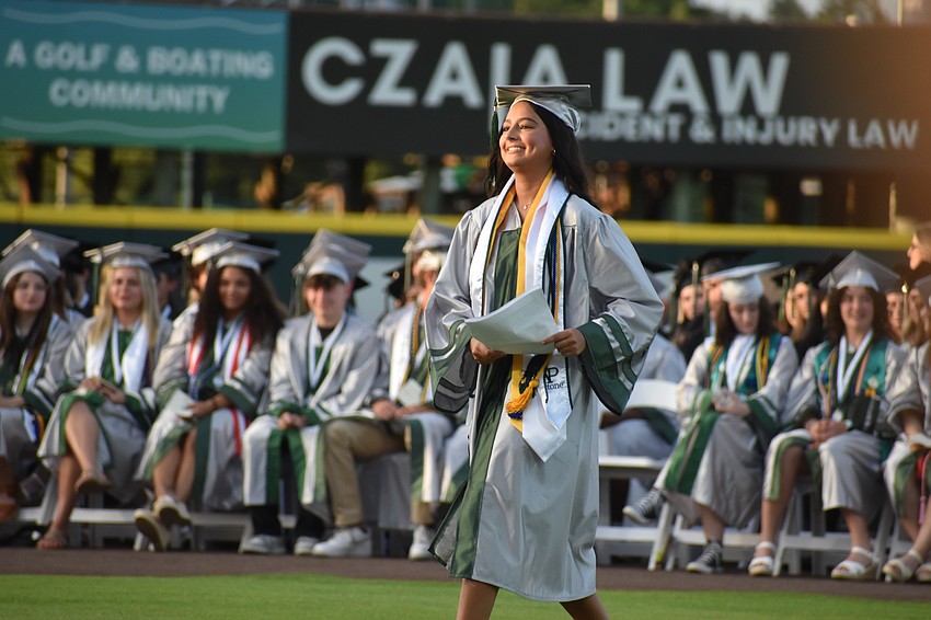 Valedictorian Olivia Spiegel walks to give her speech at the commencement ceremony. She plans to attend Georgia Institute of Technology.
