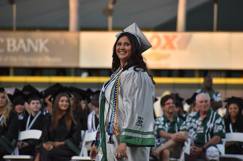 Kendall Huerta is in the top 10% of the graduating seniors which is symbolized by the silver robe. Her ranking is 44th.