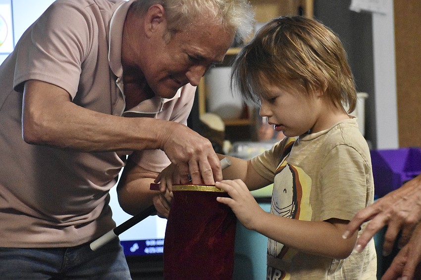 Kevin Spencer performs in a Fruitville Elementary classroom.
