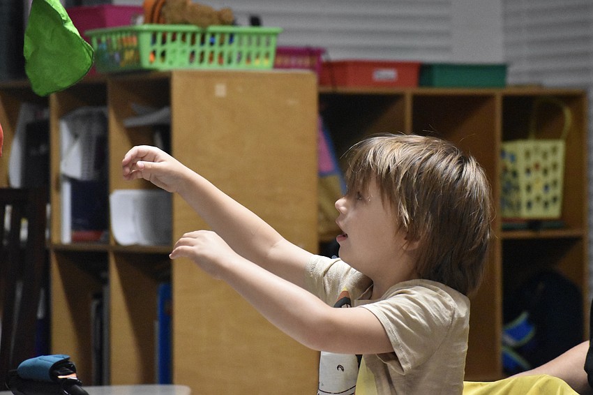A student at Fruitville Elementary watches as Kevin Spencer performs.