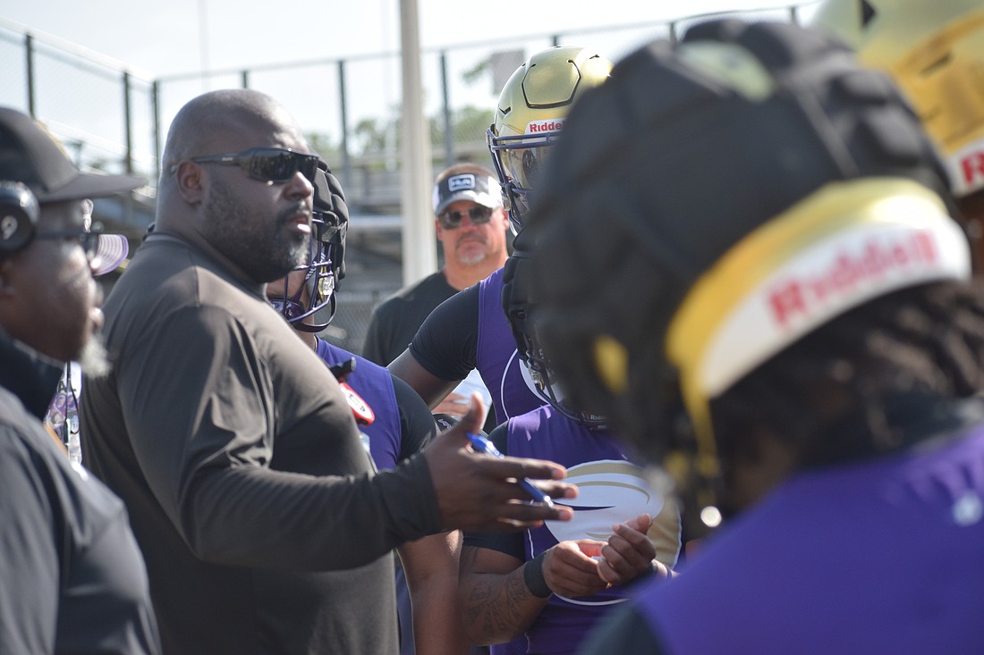 New Booker head football coach Carlos Woods has united the Tornadoes after former coach Scottie Littles resigned in April.