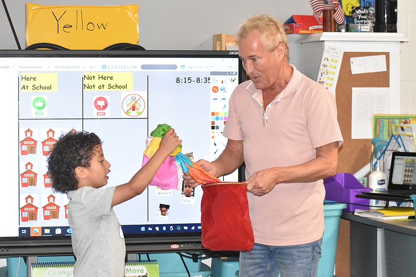 Kevin Spencer performs in a Fruitville Elementary classroom.