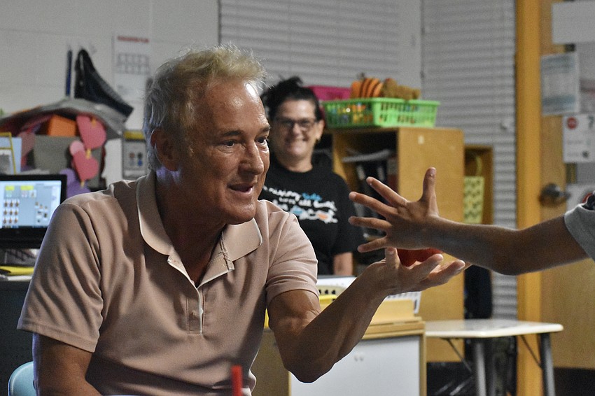 Kevin Spencer performs in a Fruitville Elementary classroom.