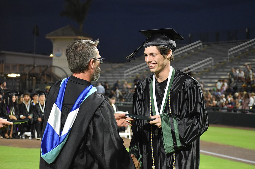 Eduardo Zoppe receives his diploma at the commencement ceremony. Zoppe teaches a stage technology class at Ovation School of Musical Theatre.