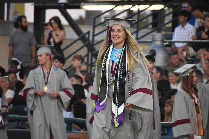 Marleigh Mruk, a top 10% graduate, makes her way toward her diploma.