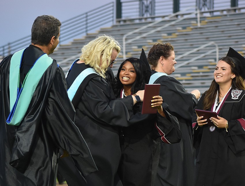 Jaliyah Gibson receives a hug from assistant principal Laura Gonzales.