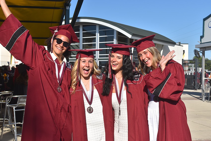 Kaele Smith, Sophia Eastman, Miley Walker and Sam Baker show their excitement for graduating from Braden River High School.