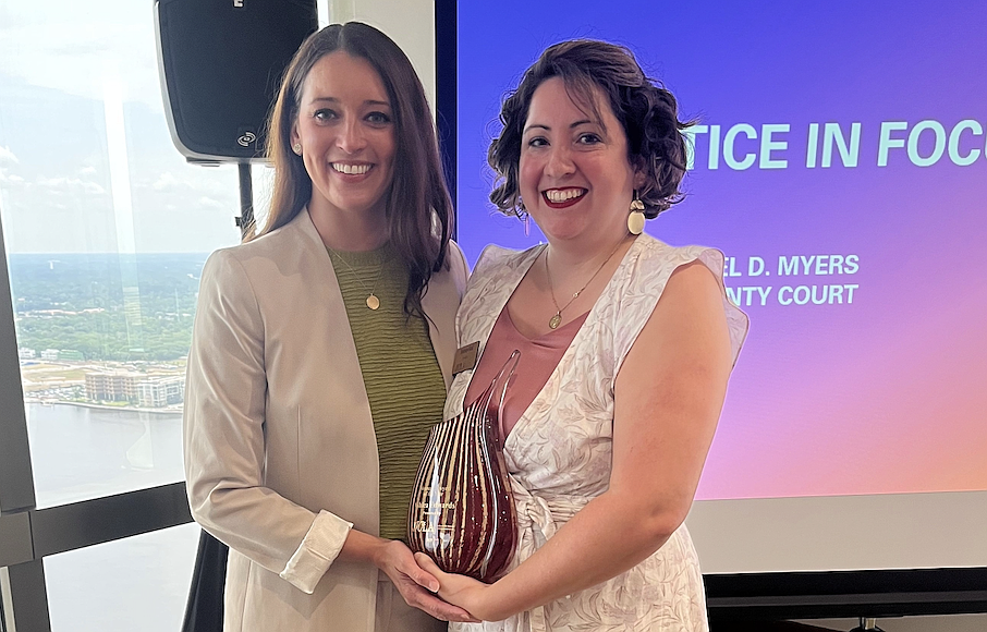 2025 Jacksonville Women Lawyers Association Woman Lawyer of the Year Ashlea Edwards, left, and JWLA President Brittany Ford.
