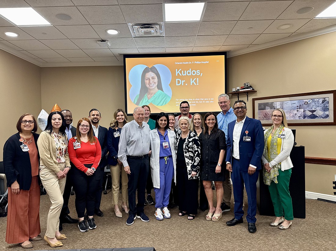Steve and Linda Weisz, center, with Dr. Inga Khachaturova, reunited with the doctor and care team that saved Steve Weisz’s life after he experienced organ failure.