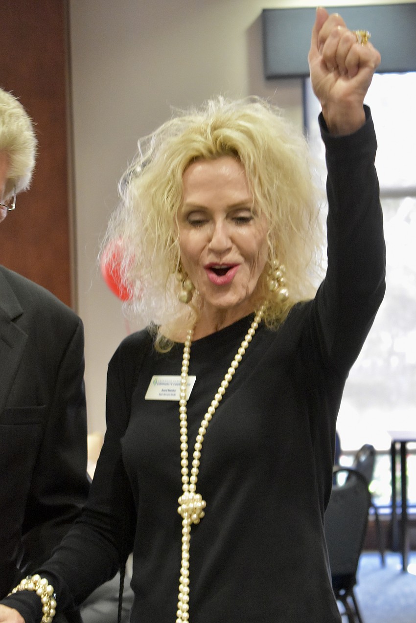 Nyda Bittmann-Neville celebrates a winning hand in blackjack. Bittmann-Neville has been a board member since 2023.